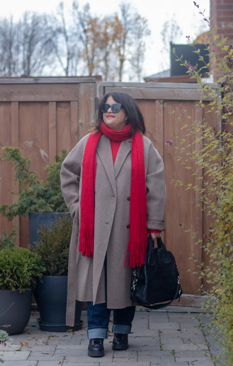 dark beige coat with red scarf