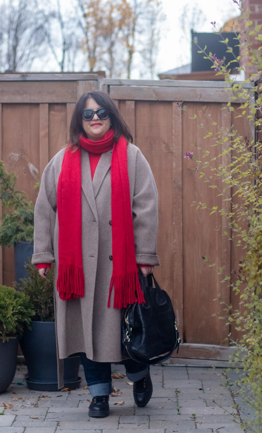 dark beige coat and red scarf