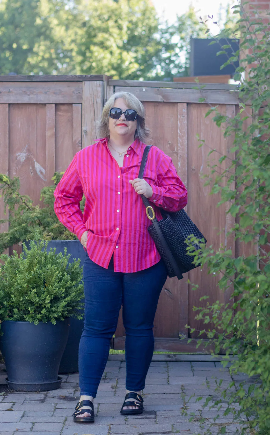 skinny jeans with oversized button front stripe shirt