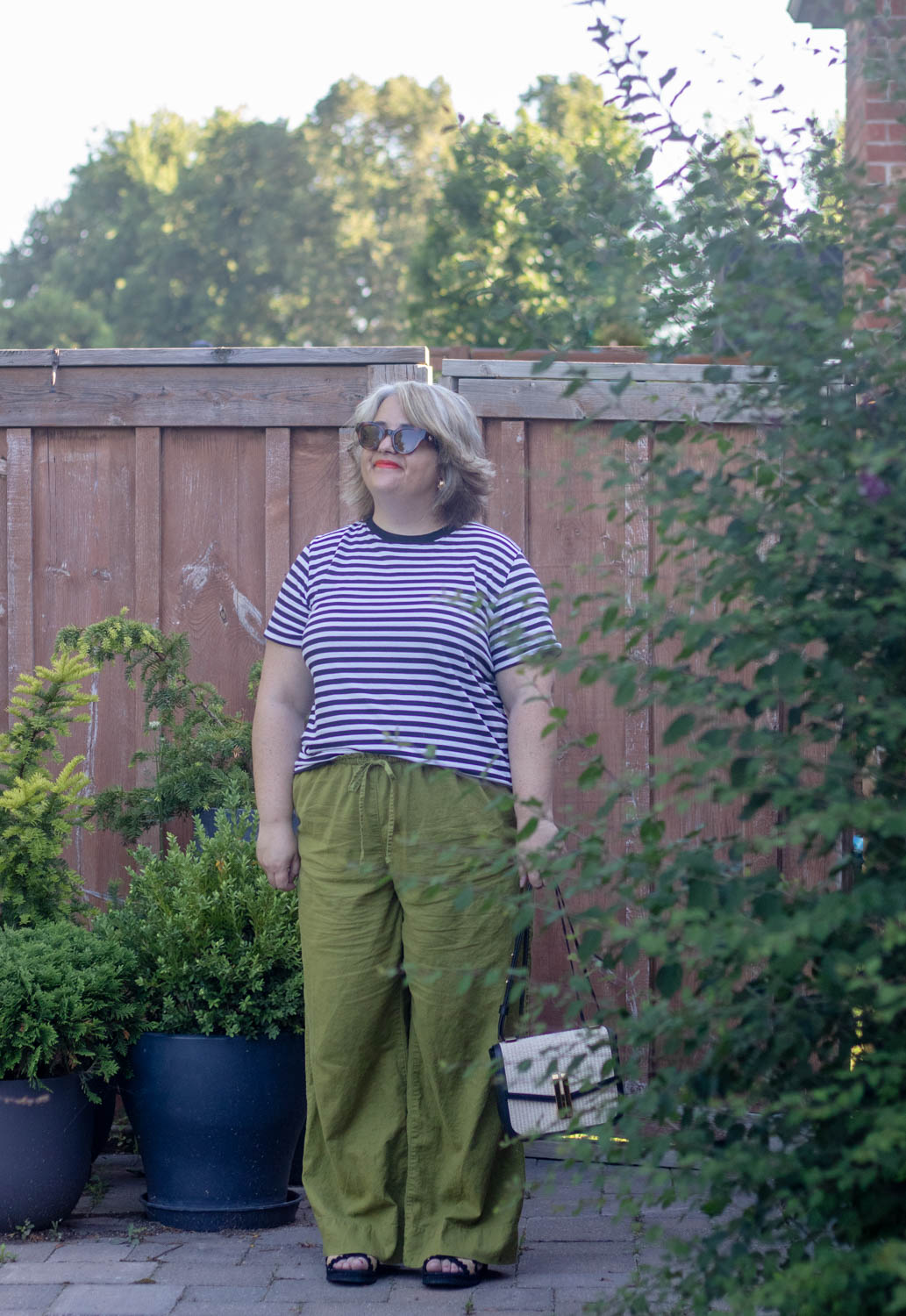 green linen pants outfit with stripe tee