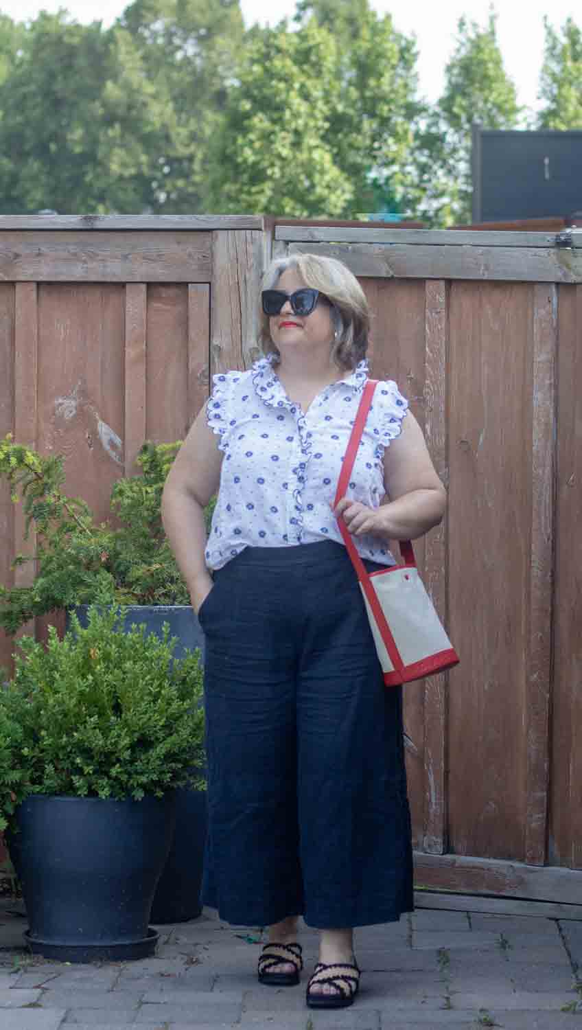 navy linen culottes with sleeveless embroidered blouse