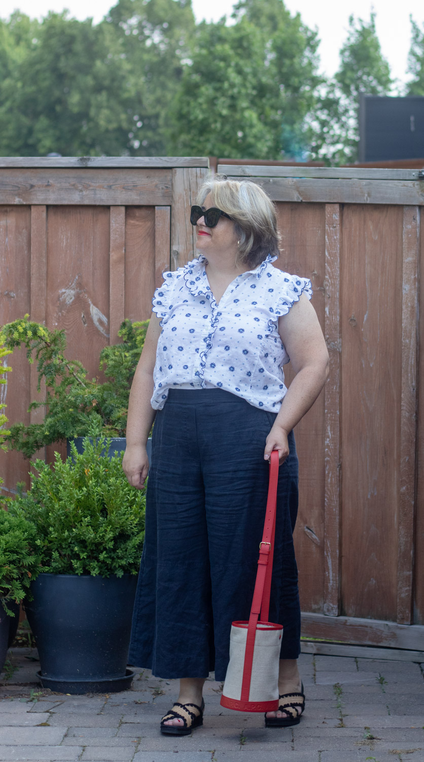 navy linen culottes with sleeveless embroidered blouse