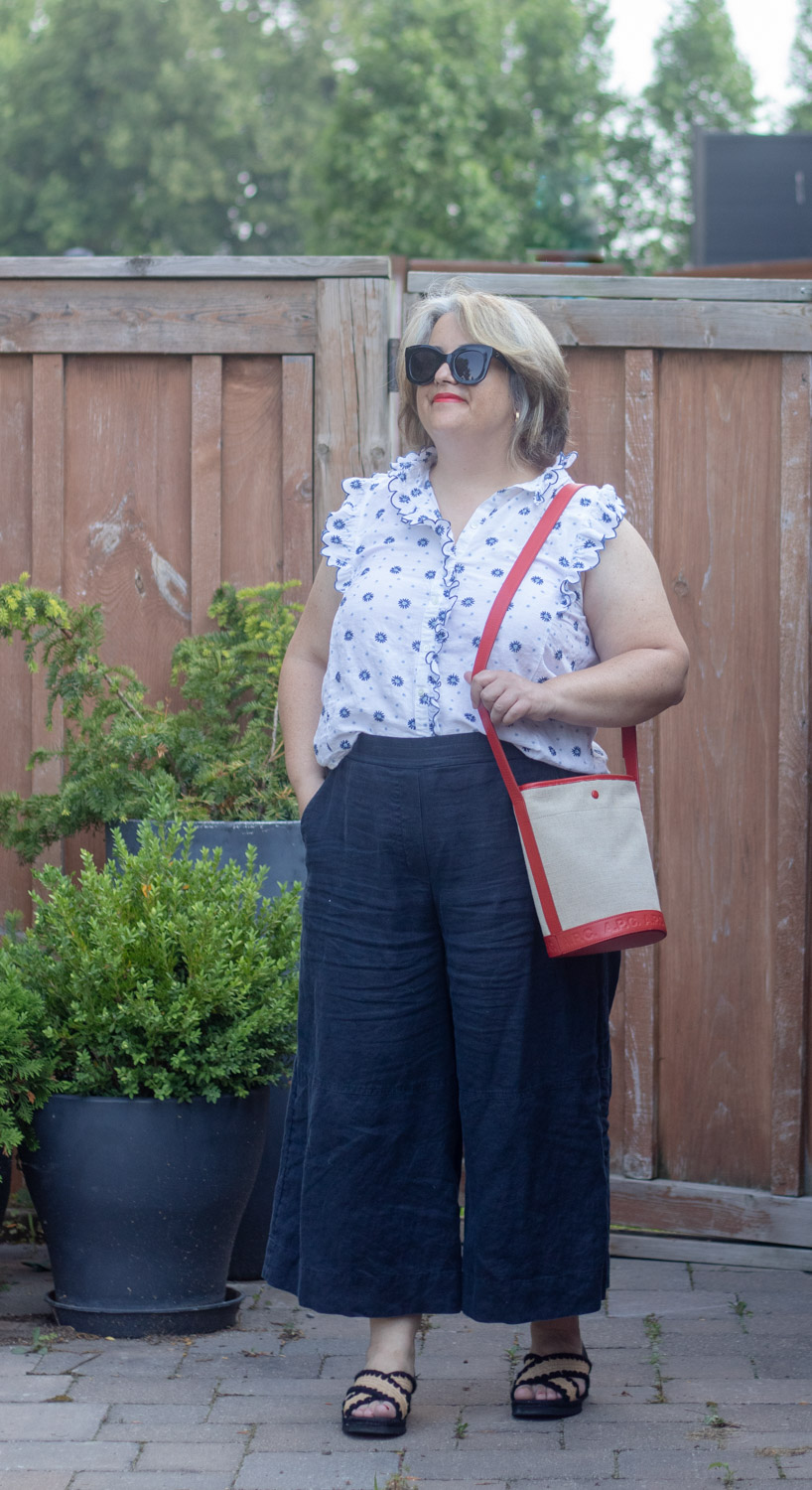 navy linen culottes with sleeveless embroidered blouse