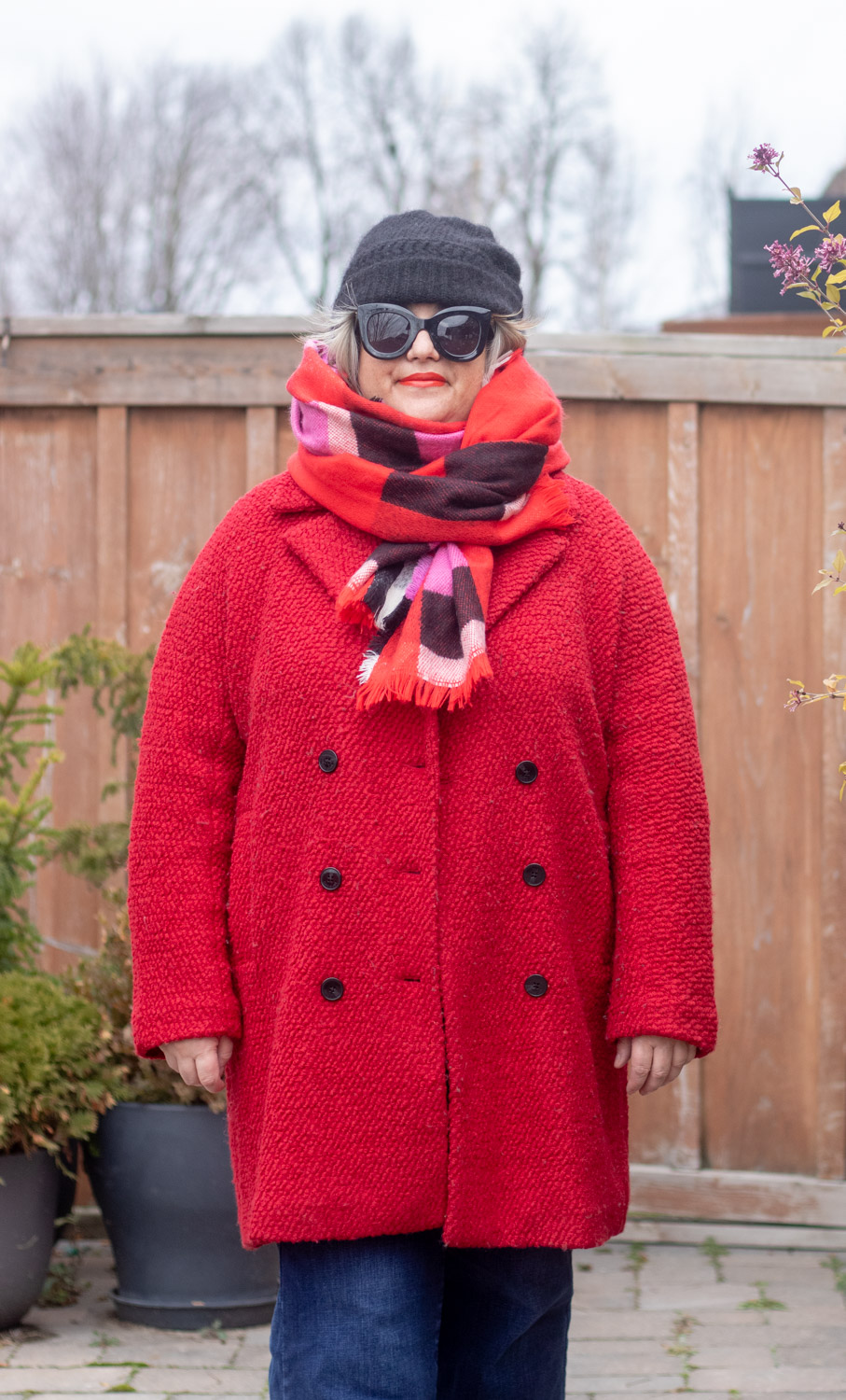 red coat with red plaid scarf