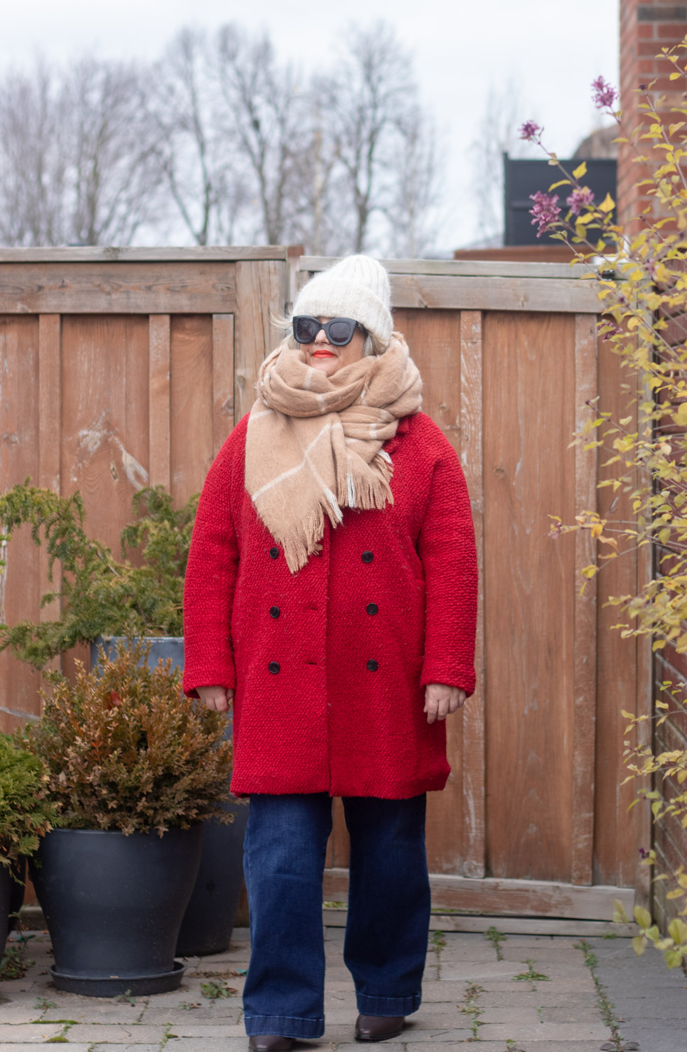 red coat with camel scarf