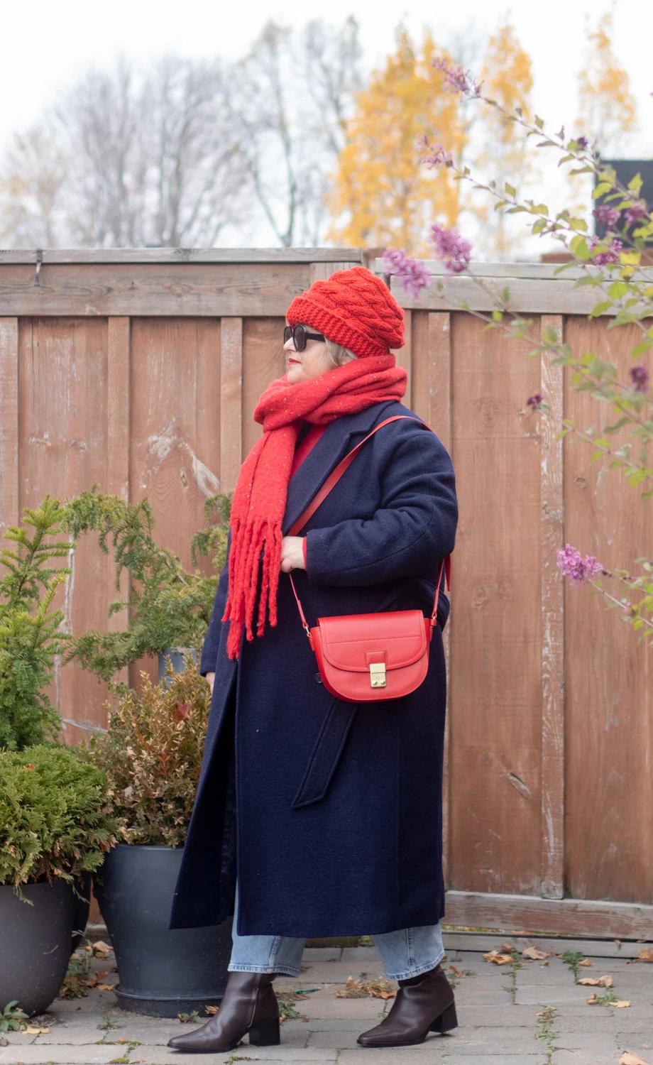 navy coat and red accessories outfit