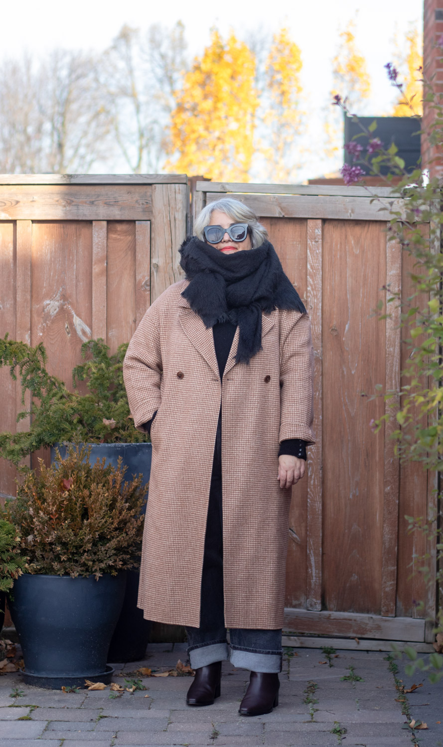 brown houndstooth coat and black scarf