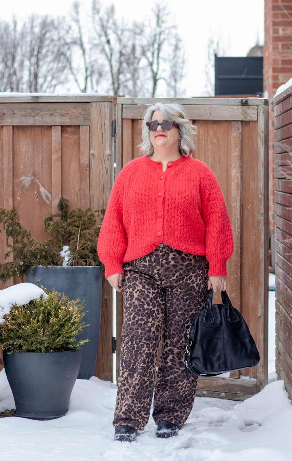 leopard jeans with red chunky sweater